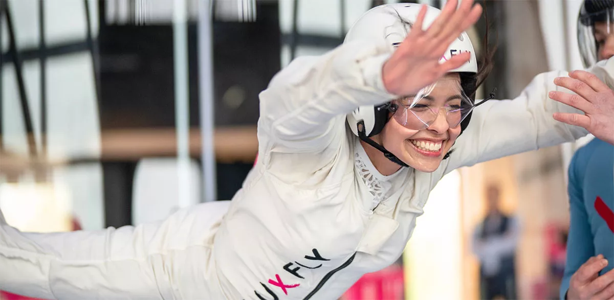 A smiling flyer in the LUXFLY wind tunnel